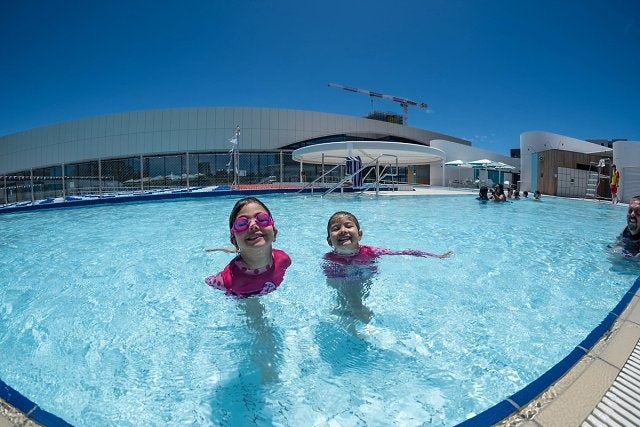 Children enjoying the outdoor heated pool at Gunyama Park Aquatic and Recreation Centre