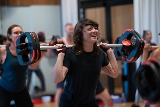 Woman smiling in a BODYPUMP class at Gunyama Park Aquatic and Recreation Centre