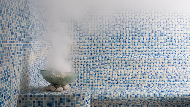 Steam filling up a sauna and steam room