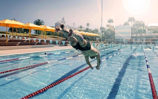 Male swimmer diving into Prince Alfred Park Pool