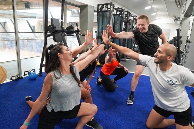 Group exercise class participants in the gym at Cook + Philip Park Pool